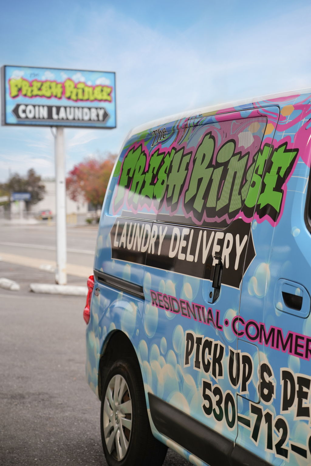 Fresh Rinse laundry pickup and delivery service — staff folding laundry